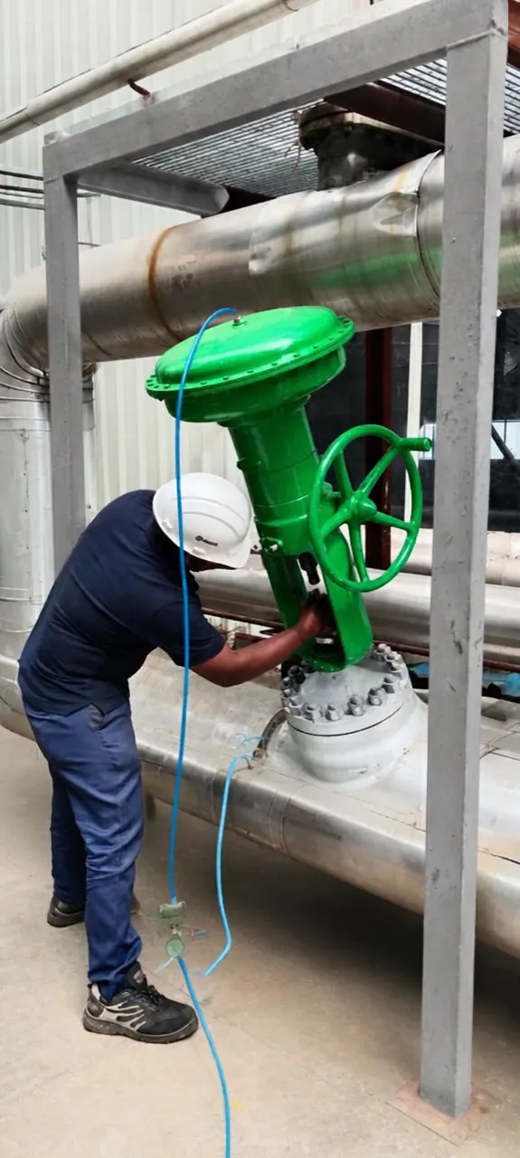 Technician checking a valve actuator onsite