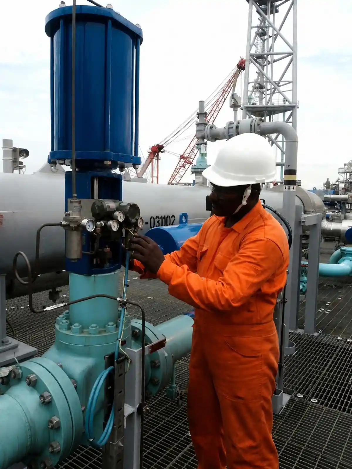 Technician troubleshooting a severe service valve onsite